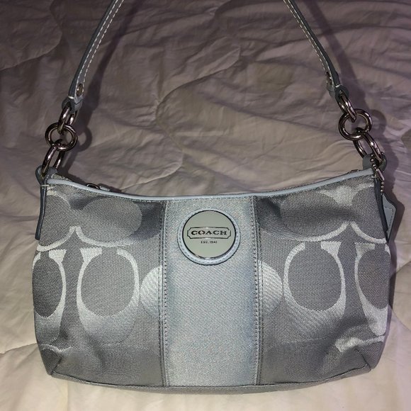 Coach Handbags - Baby blue Coach Signature Cross purse.